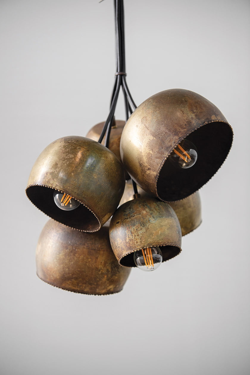 One recent fixture was fabricated from repurposed brass bowls.