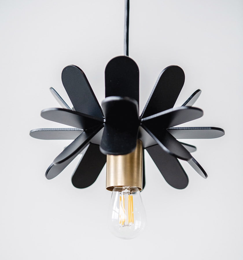 Newly fabricated, painted aluminum in the form of a modern flower.